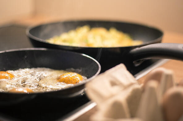 Eggs cooking in non-stick pans