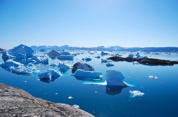 Greenland shoreline with icebergs