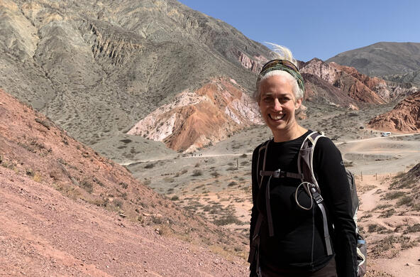 Cary Institute senior scientist Amy Zanne with desert and mountains in the background