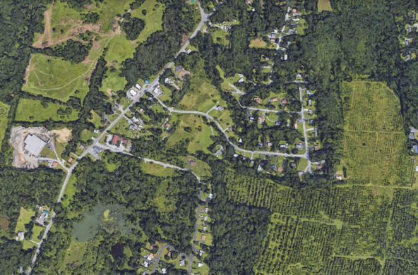 aerial view of developed areas, farmland, and forest patches