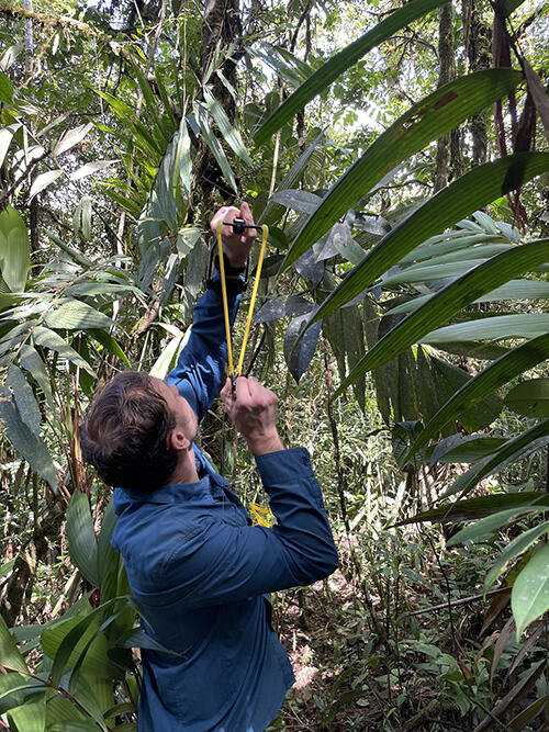 evan gora taking aim with a slingshot 